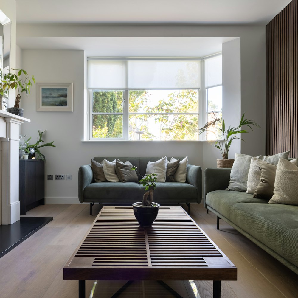 a living room filled with furniture and a fire place