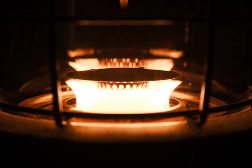 Close-up of a high-efficiency propane furnace glowing softly in a cozy home.