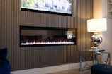 a living room with a television and a fire place