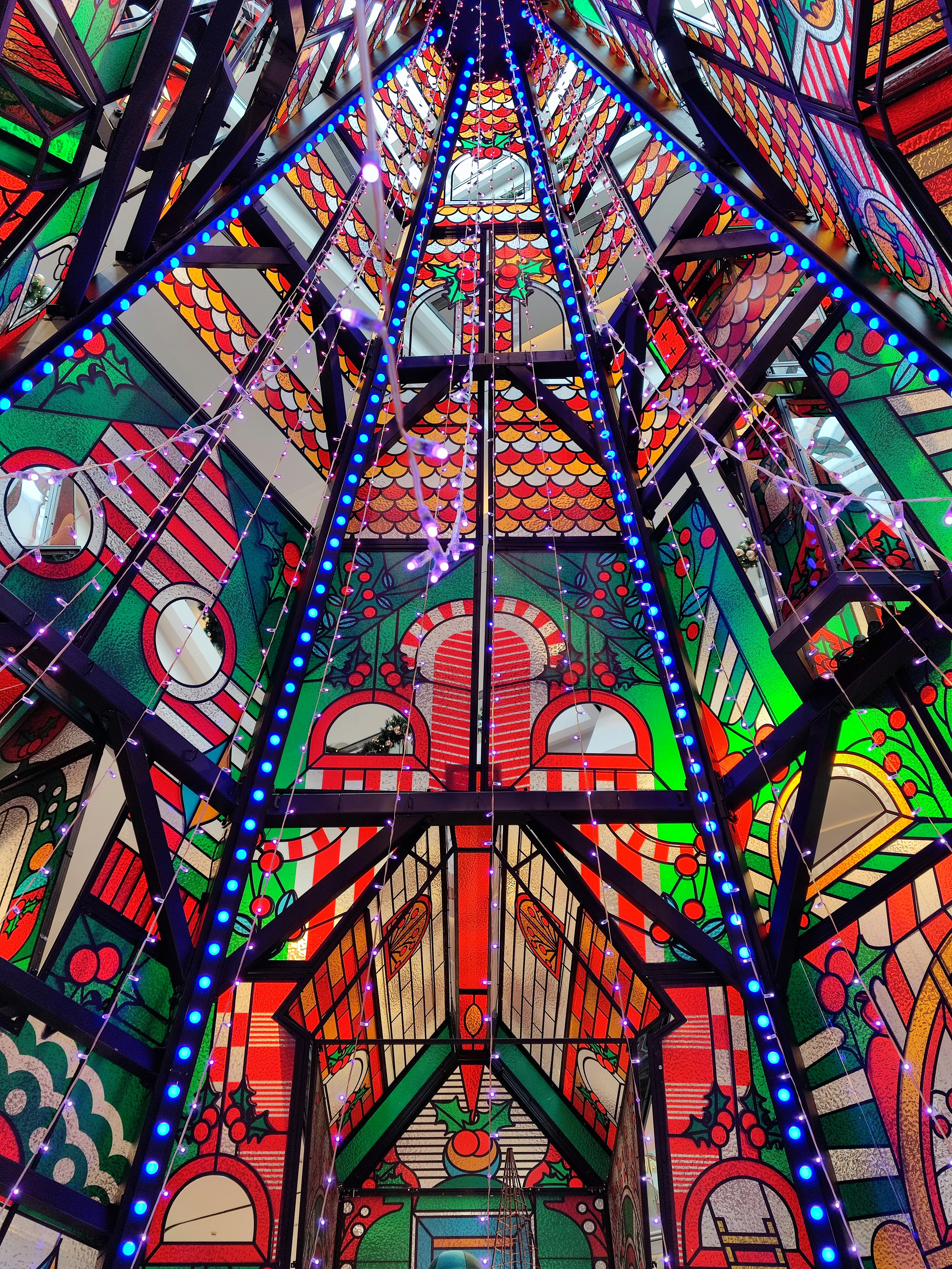 a very colorful building with a very tall ceiling