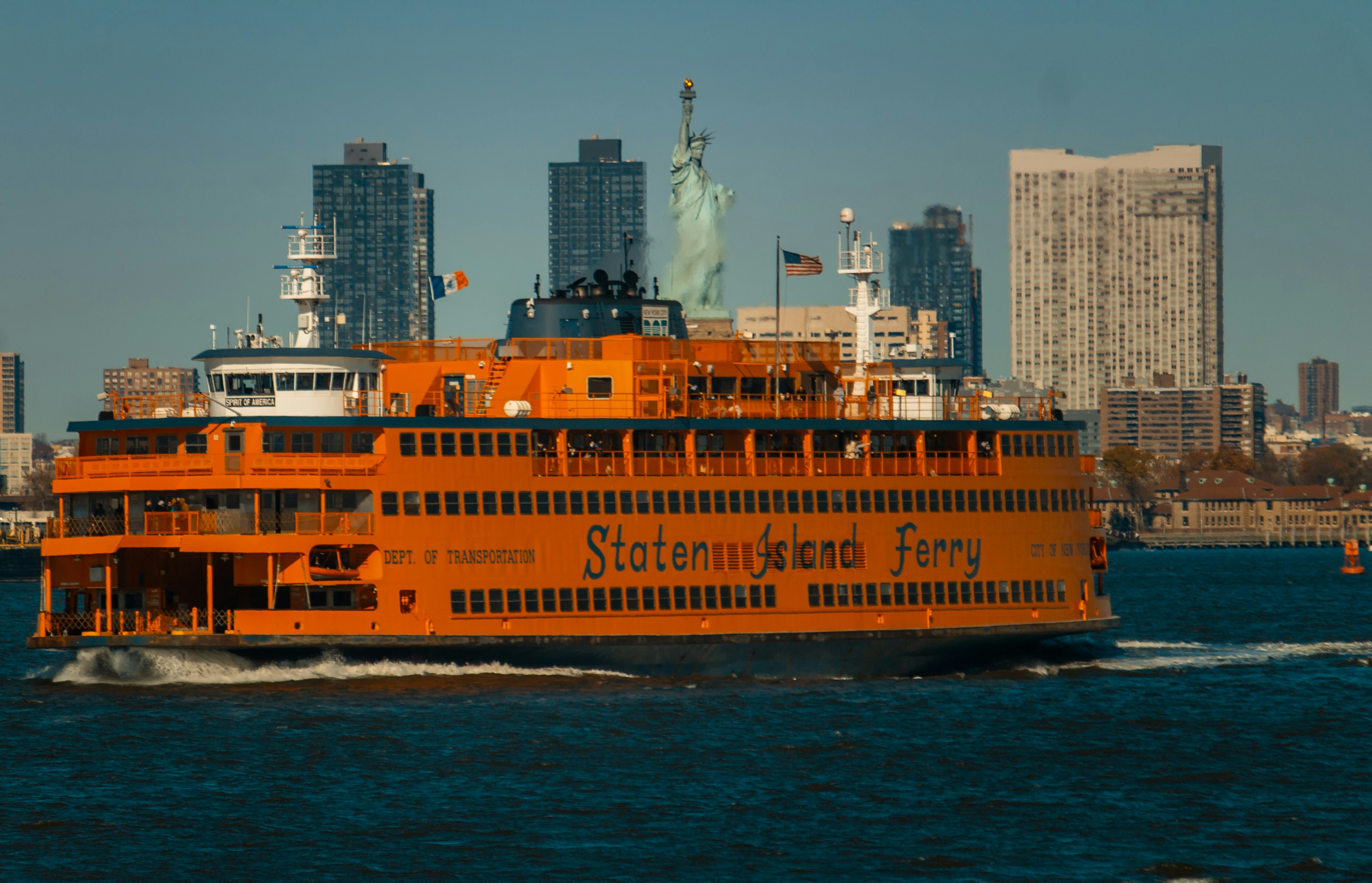 a large orange boat in a body of water