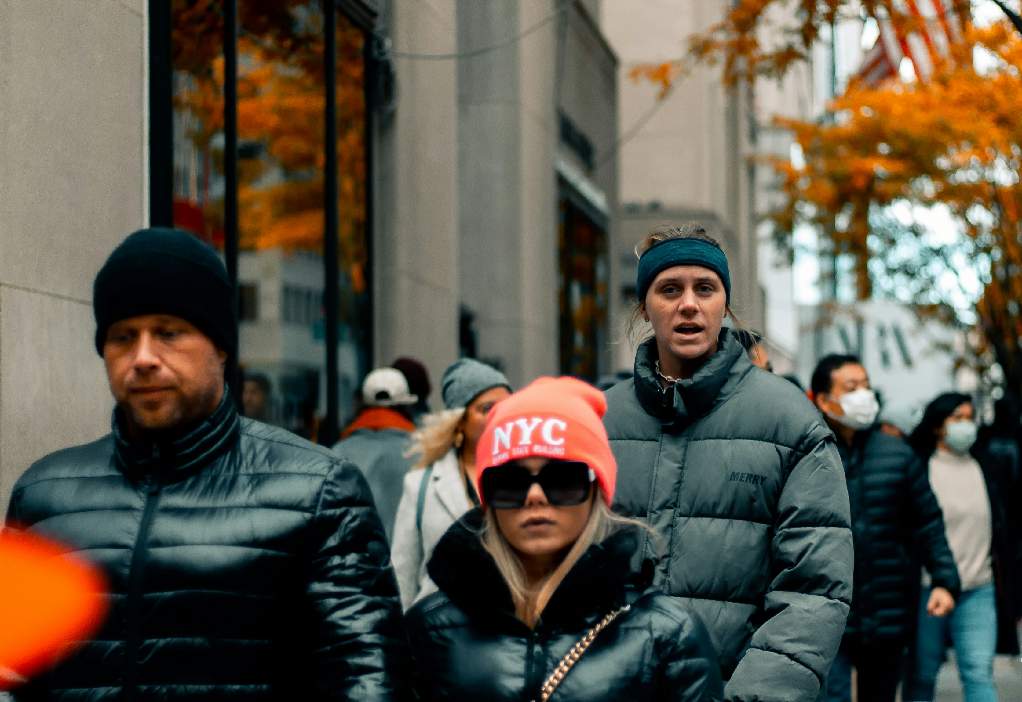a group of people walking down a street