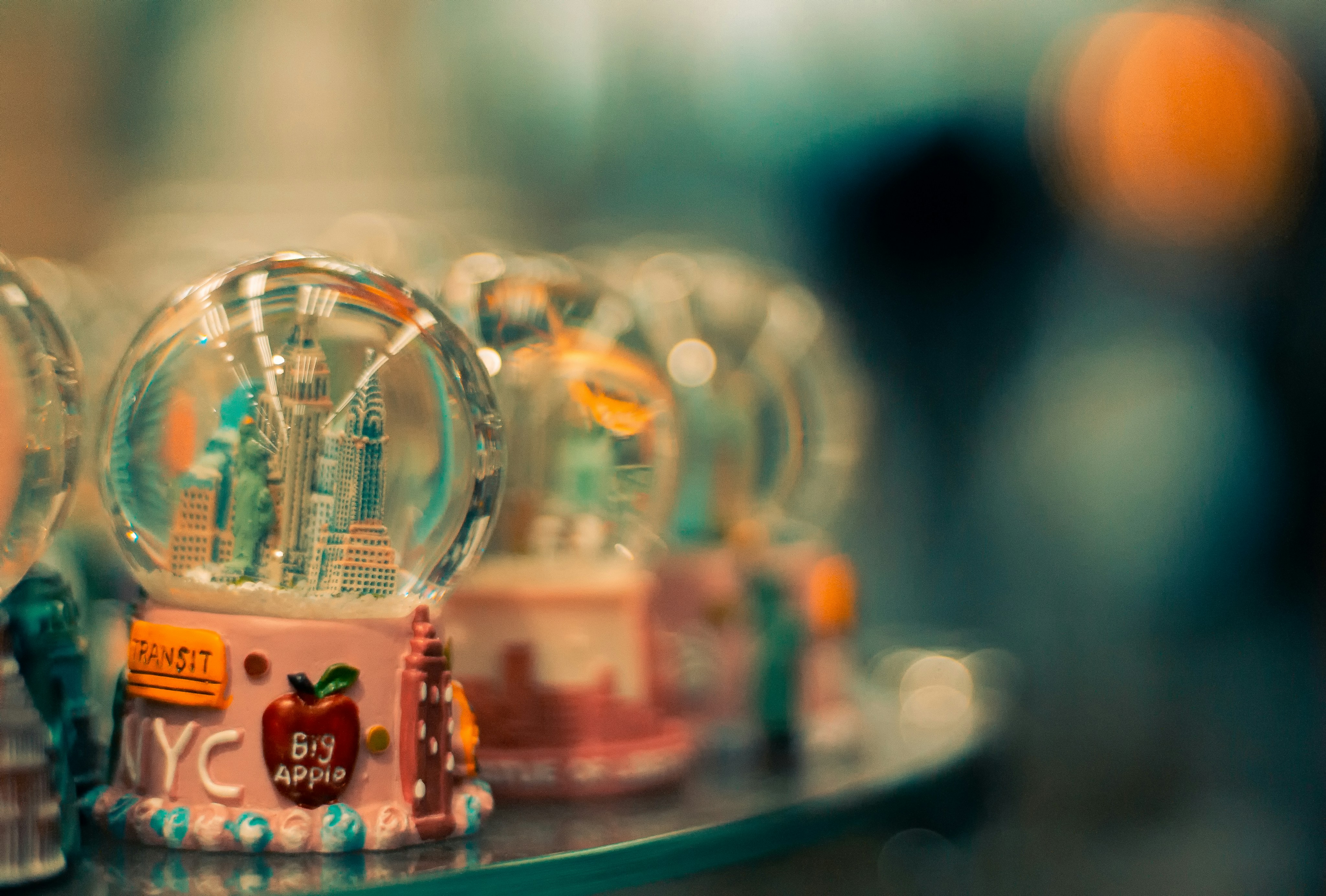 a row of snow globes sitting on top of a table