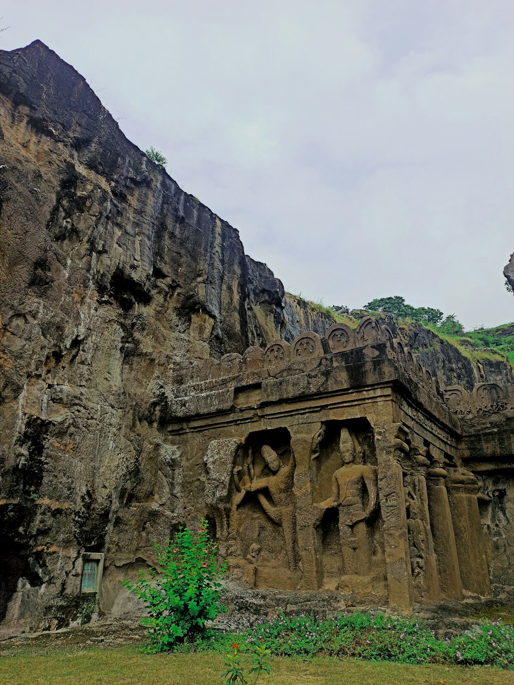 a large stone structure with carvings on the side of it
