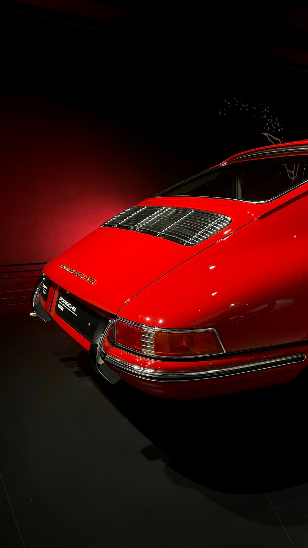 a red sports car parked in a garage