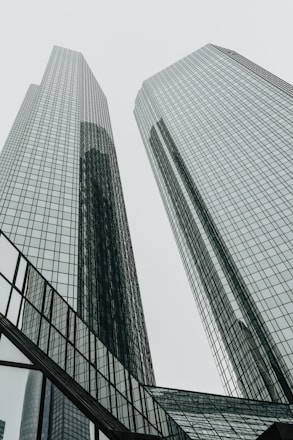 a couple of tall buildings sitting next to each other