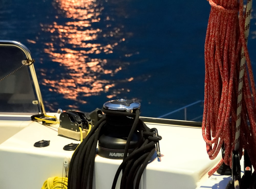 a close up of a boat's steering wheel on a body of water