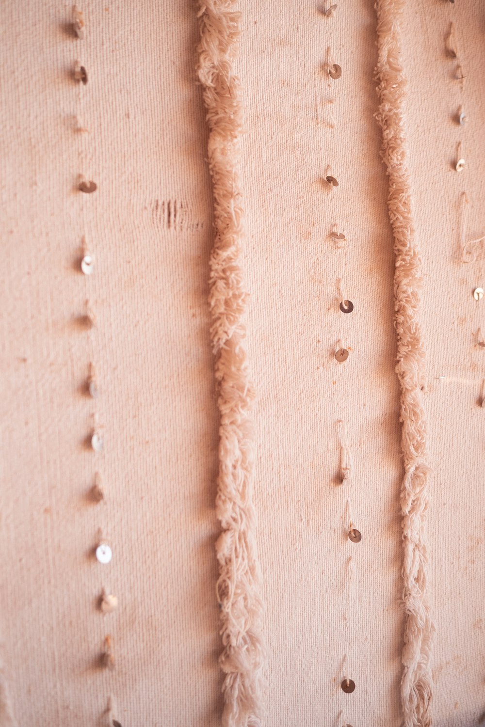 a close up of a wall with holes in it