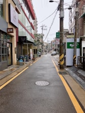 a city street with a fire hydrant in the middle of it