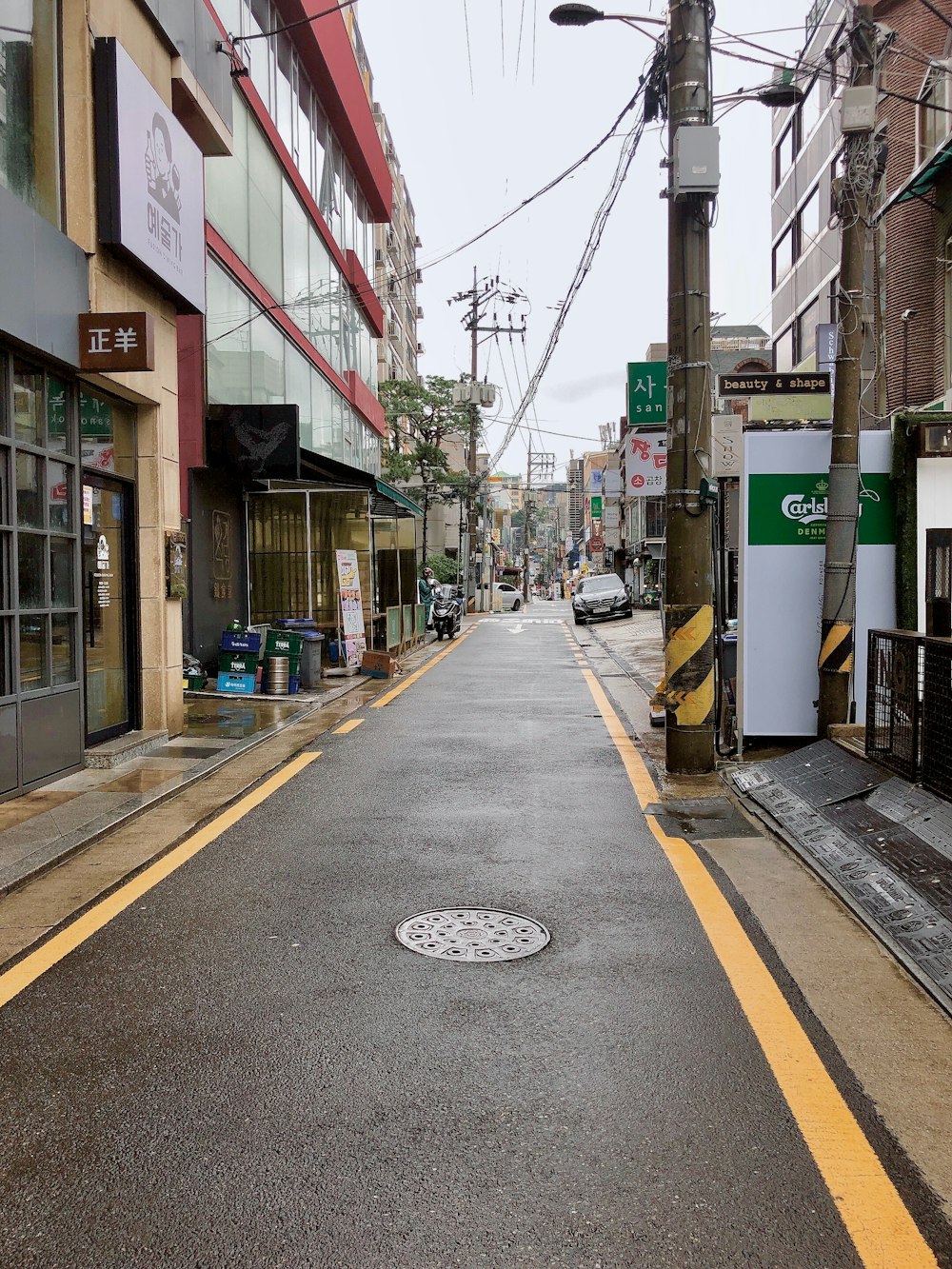 a city street with a fire hydrant in the middle of it