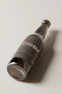 Close-up of a rustic beer label designed with minimalist typography.