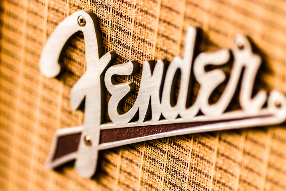 a close up of a metal sign on a wall