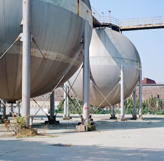 a couple of large metal tanks sitting next to each other