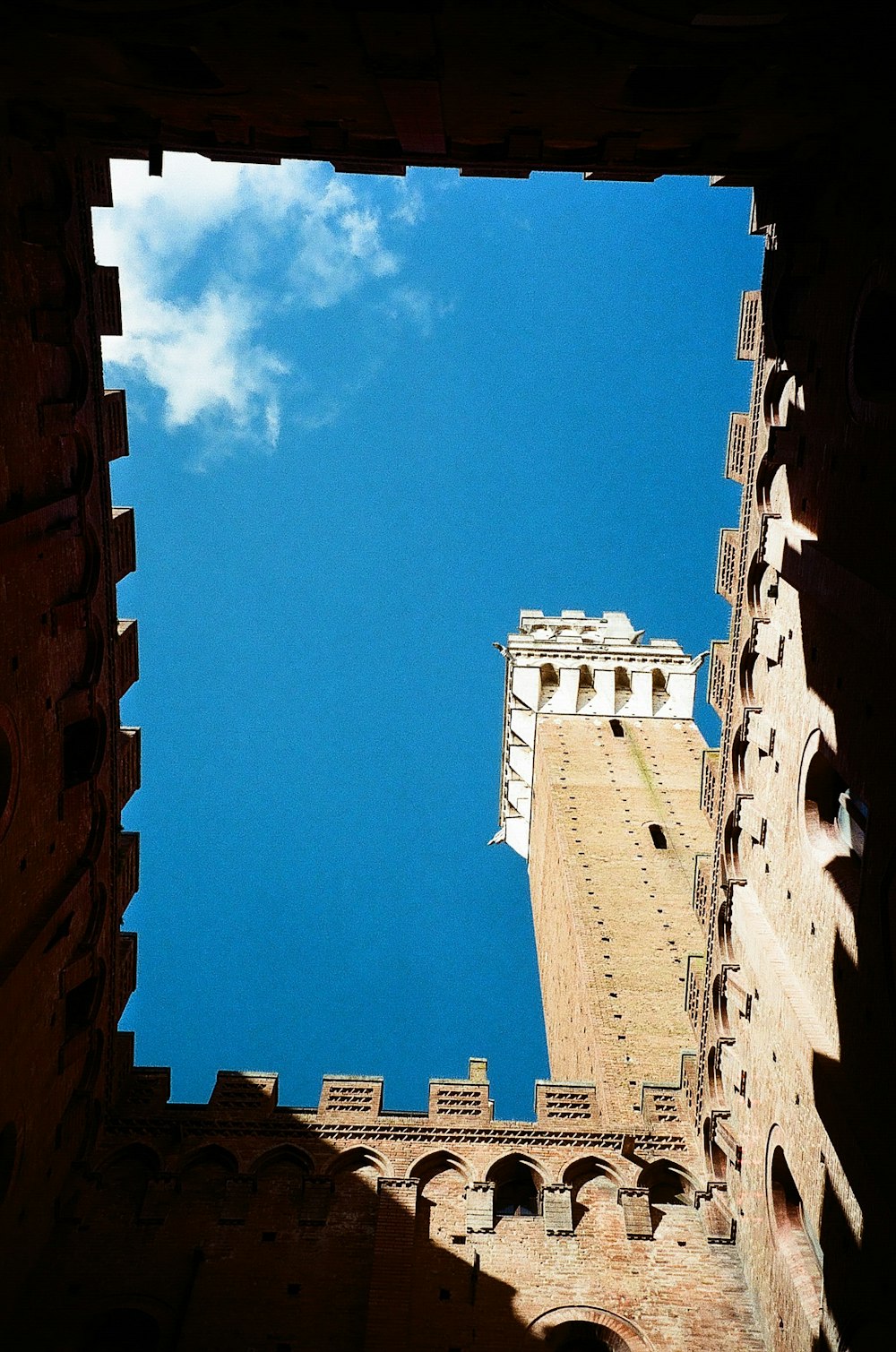 a view of a building through a hole in a wall