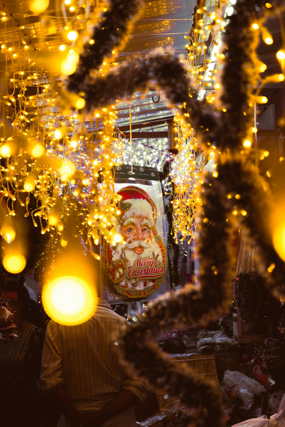 a man sitting in a room covered in lights