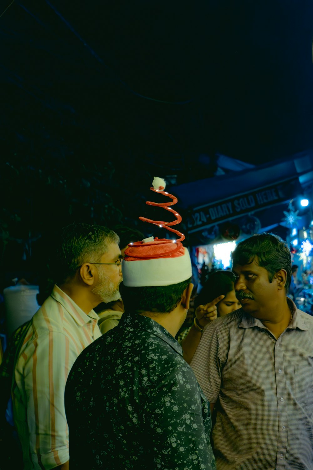 a group of men standing around each other