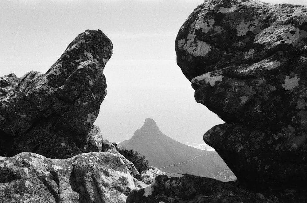 a black and white photo of rocks and mountains