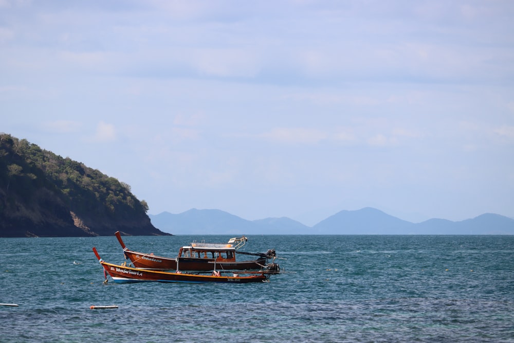 a boat floating on top of a large body of water