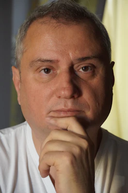 Thumbnail of a video showing Eugen Mîrtz in a calm, reflective moment during an interview