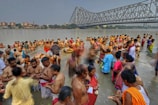 Devotees taking a holy dip in the sacred river at sunrise.