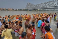 Pilgrims performing rituals along the banks of the Ganges River.