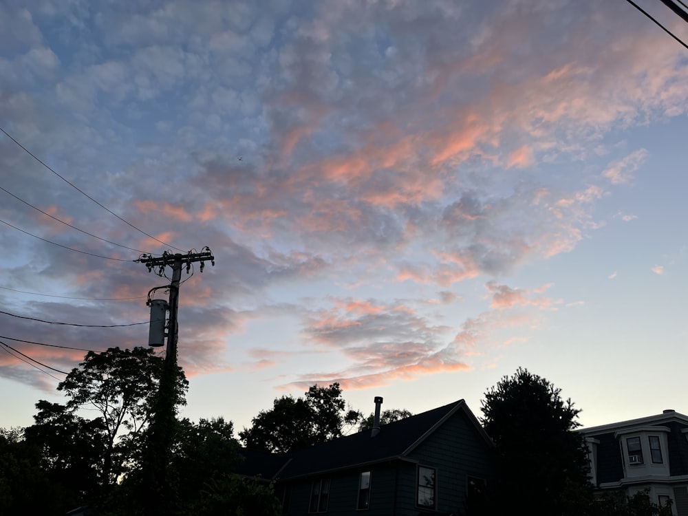 a pink and blue sky with some clouds