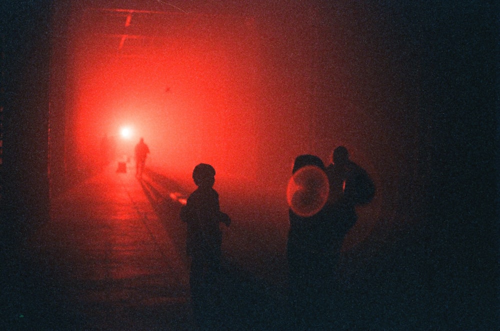 a group of people standing next to a train on a train track