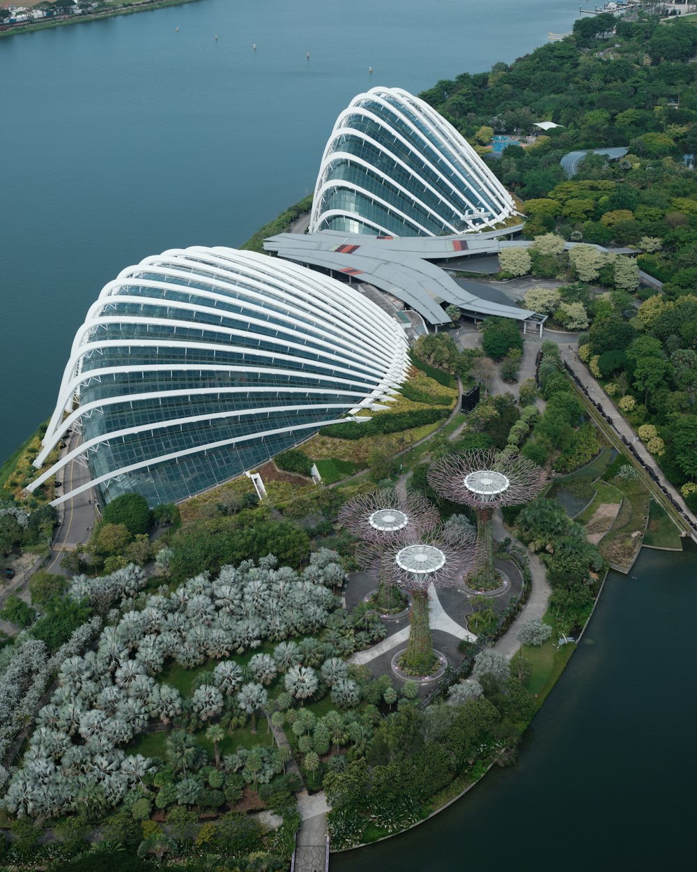 a bird's eye view of a large building next to a body of water