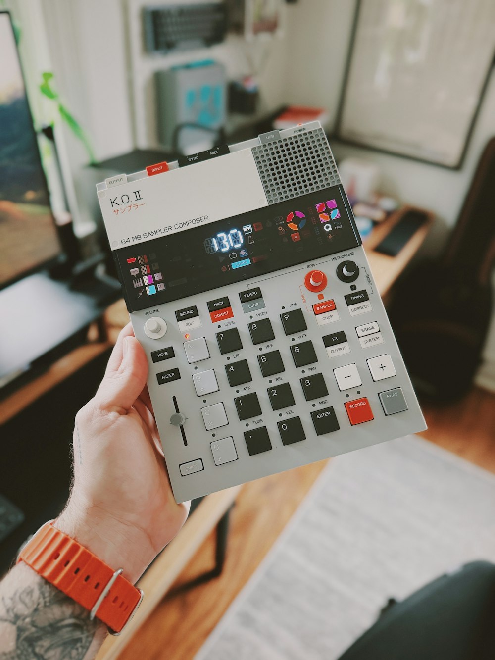 a person holding a calculator in their hand