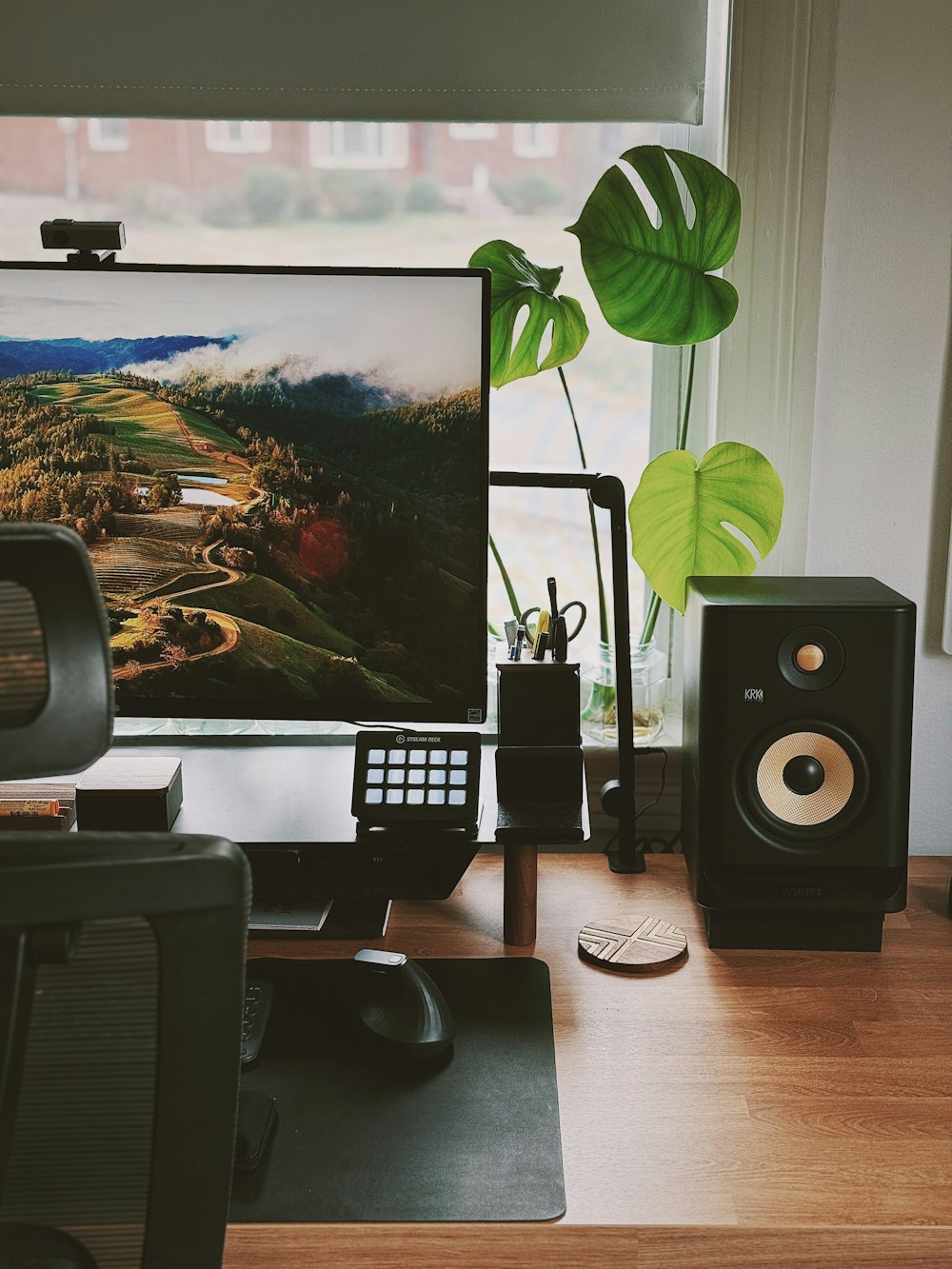 a computer monitor sitting on top of a wooden desk