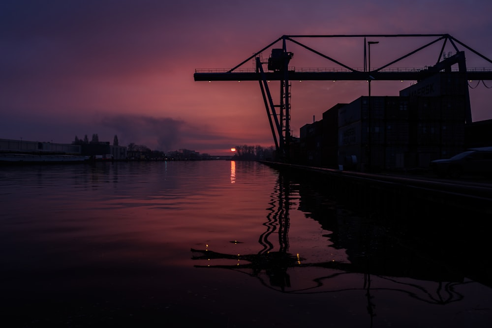 the sun is setting over a body of water