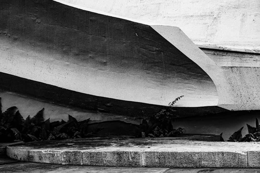 a black and white photo of a skateboarder doing a trick