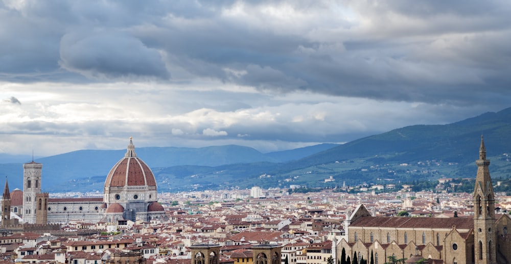 a view of a city with mountains in the background