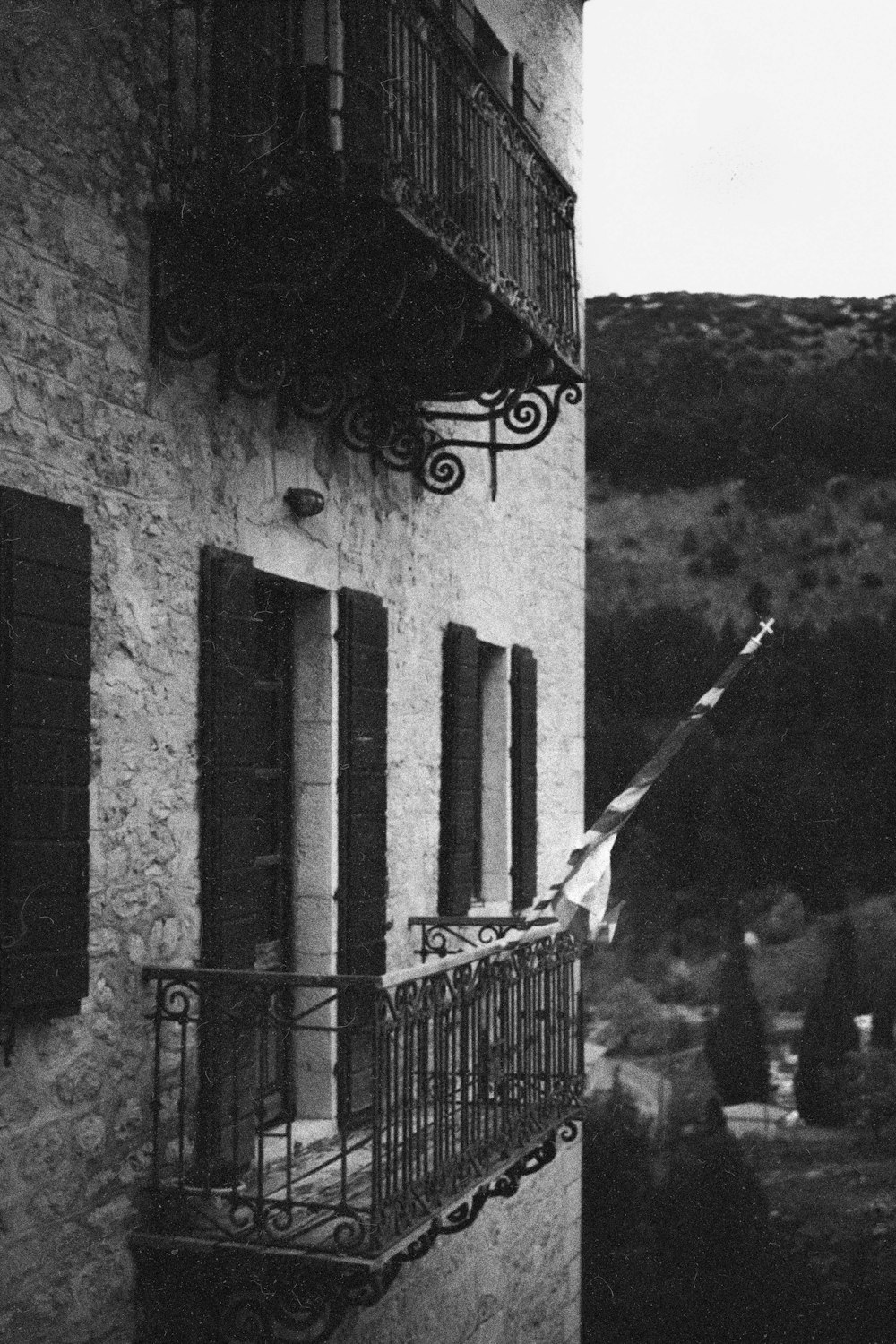 an old building with a balcony and iron railings