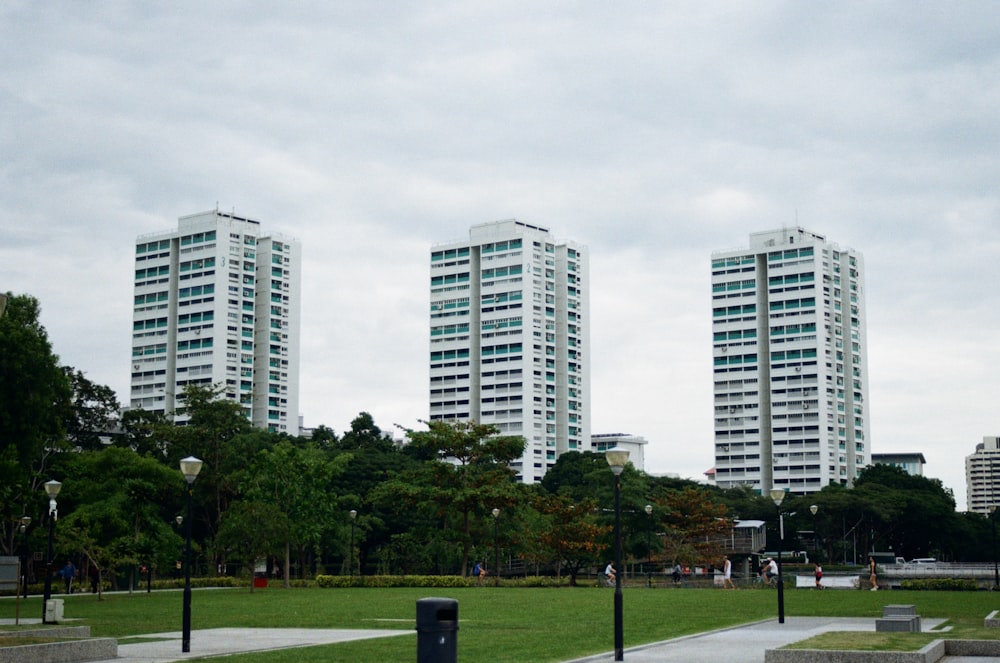 a couple of tall buildings sitting next to each other