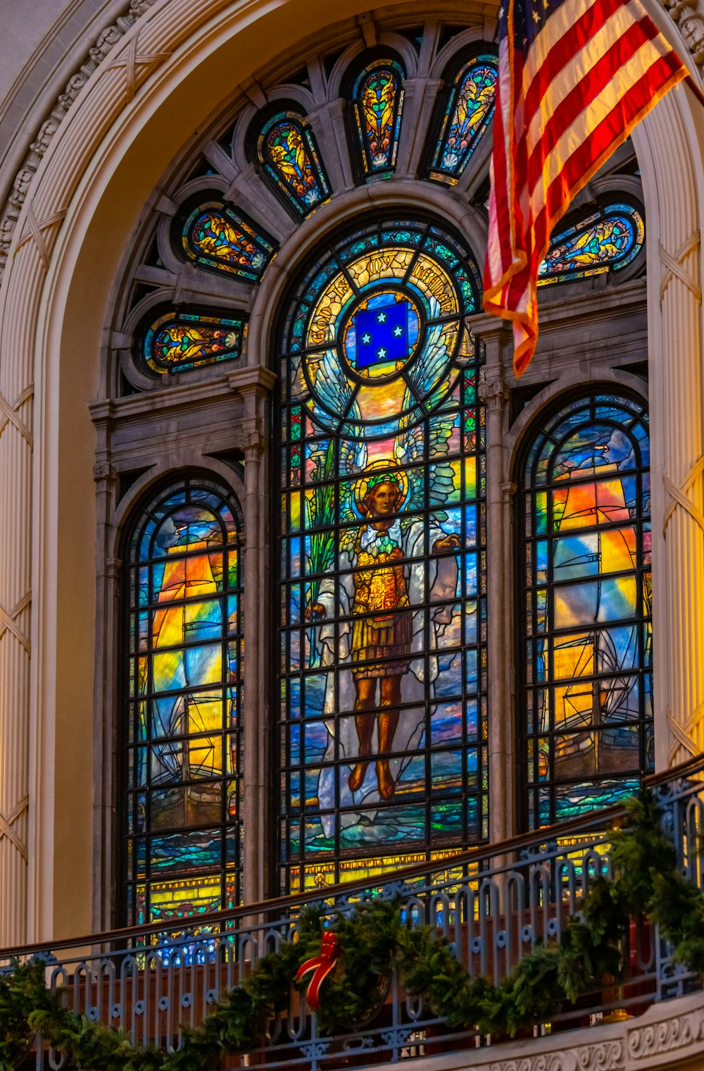 a large stained glass window in a building