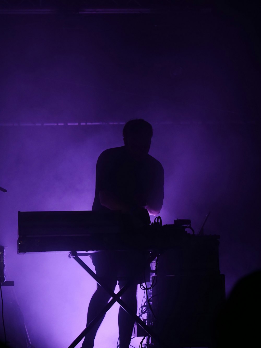 a man playing a keyboard on a stage