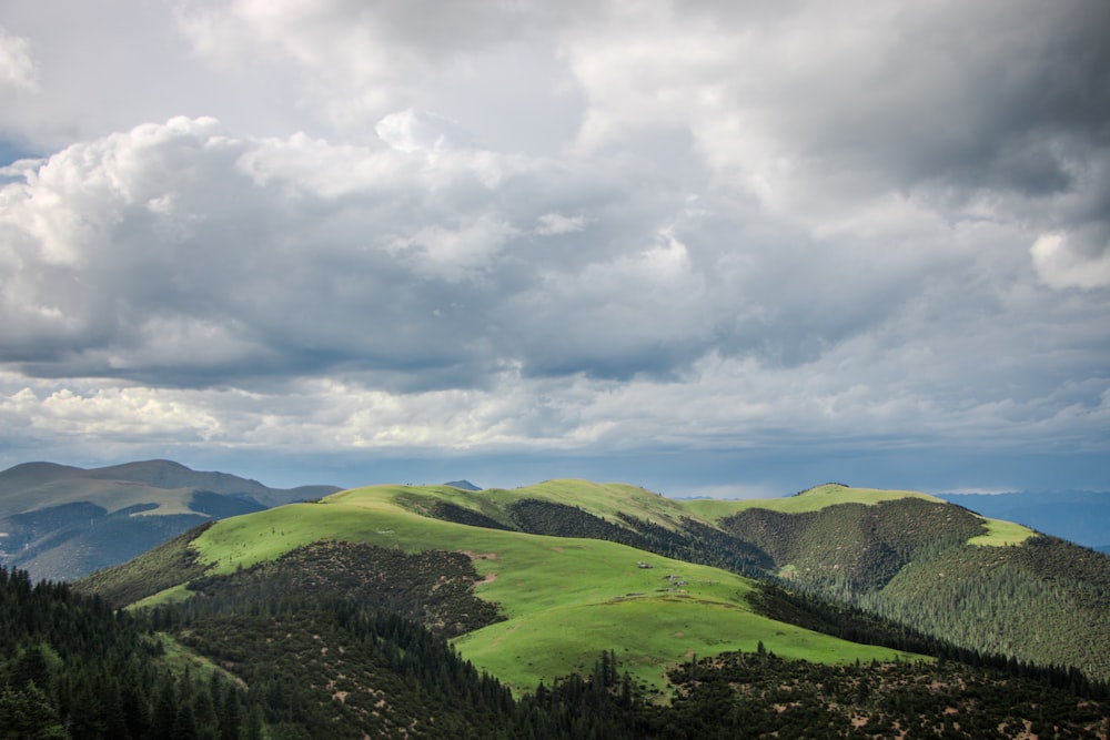 a view of a mountain range with a cloudy sky