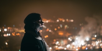 A sleek, modern jacket displayed on a city rooftop at dusk, with soft city lights glowing in the background.