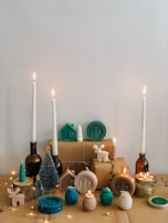 A collection of modern home decor items styled for a festive setting.