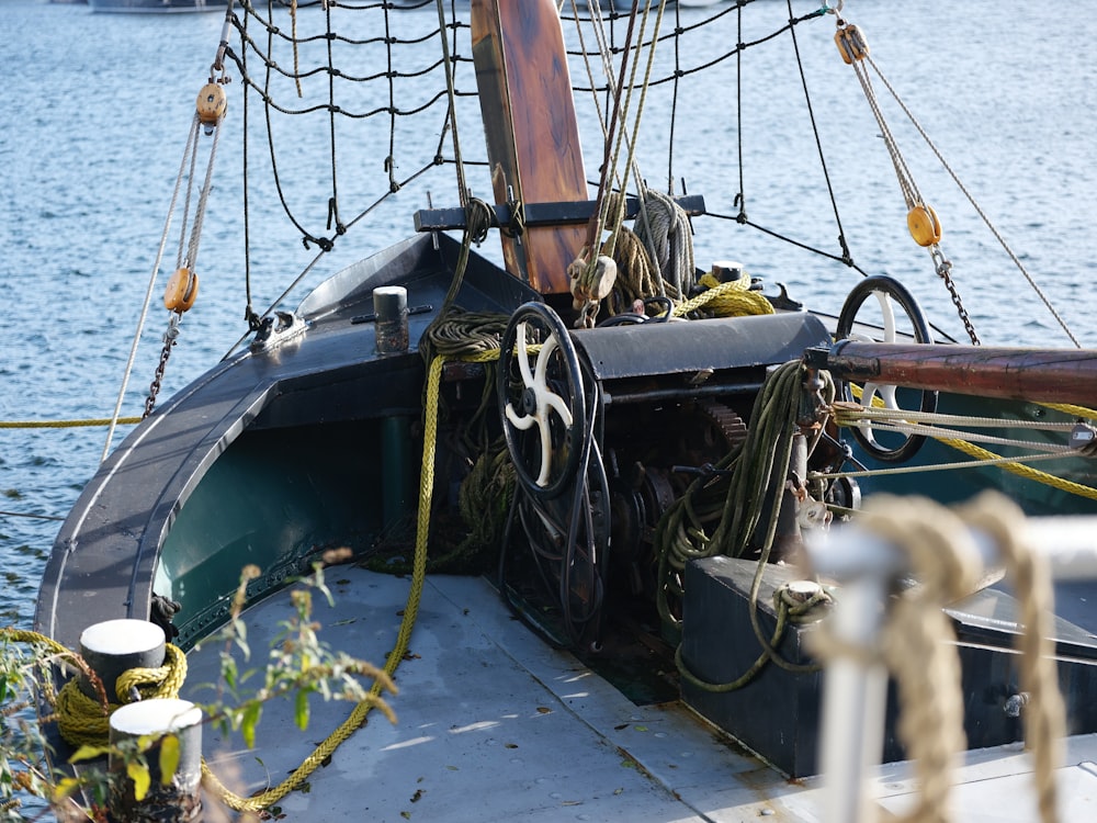 a close up of a boat with ropes on it
