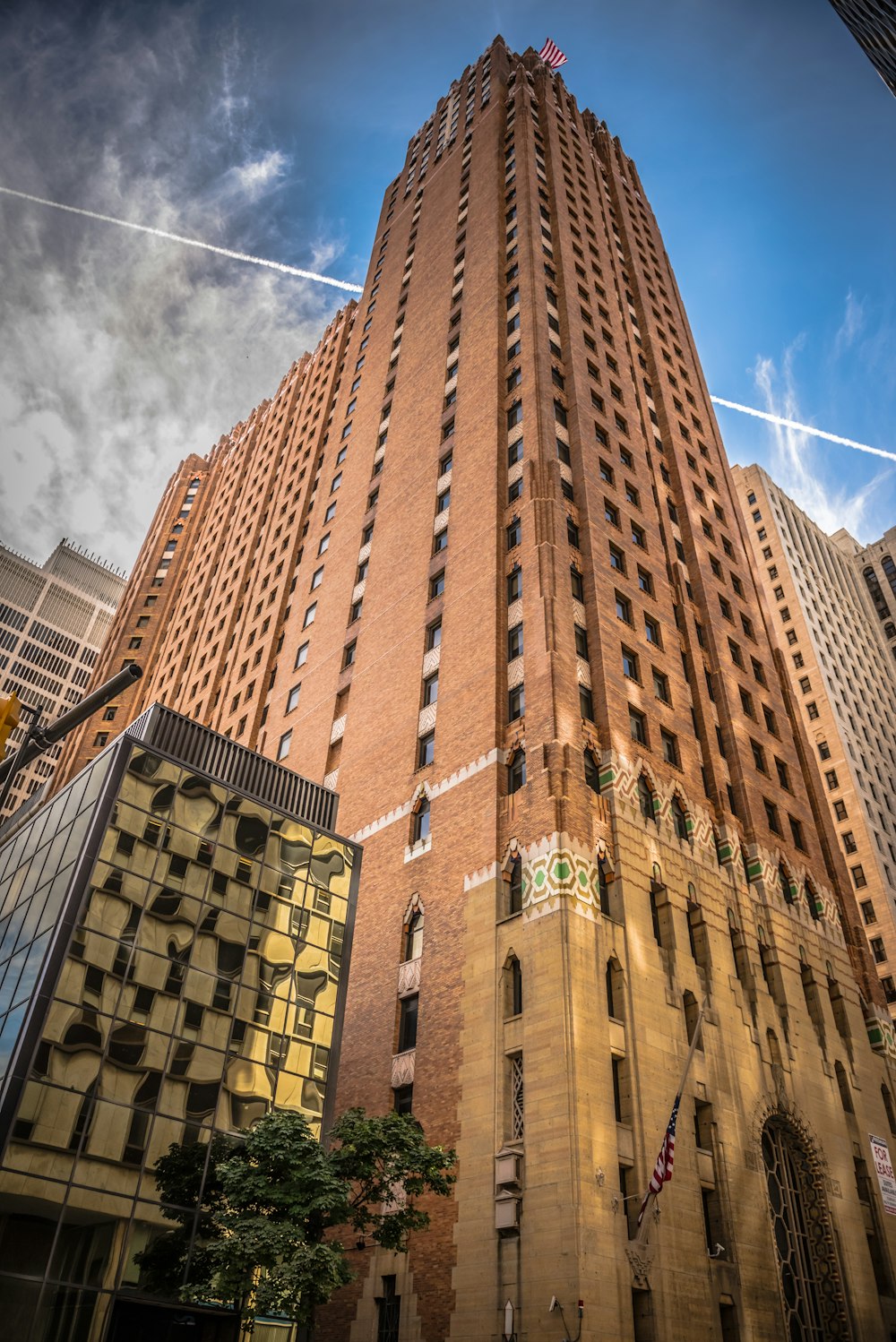 a very tall building with a sky background