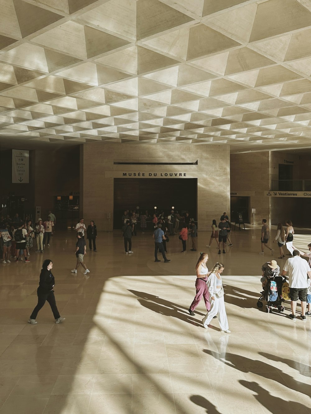 a group of people walking around a building