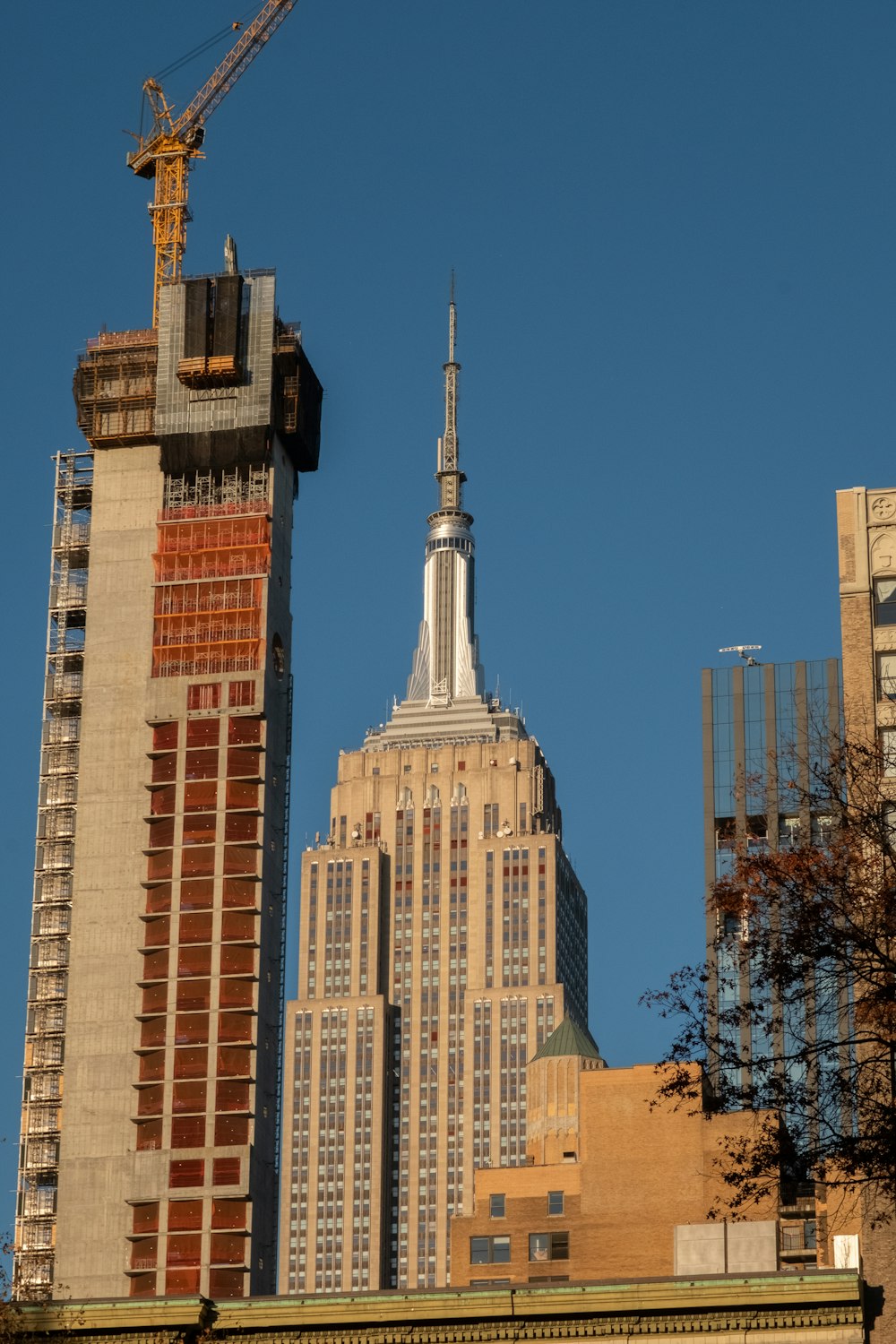 a tall building with a crane on top of it