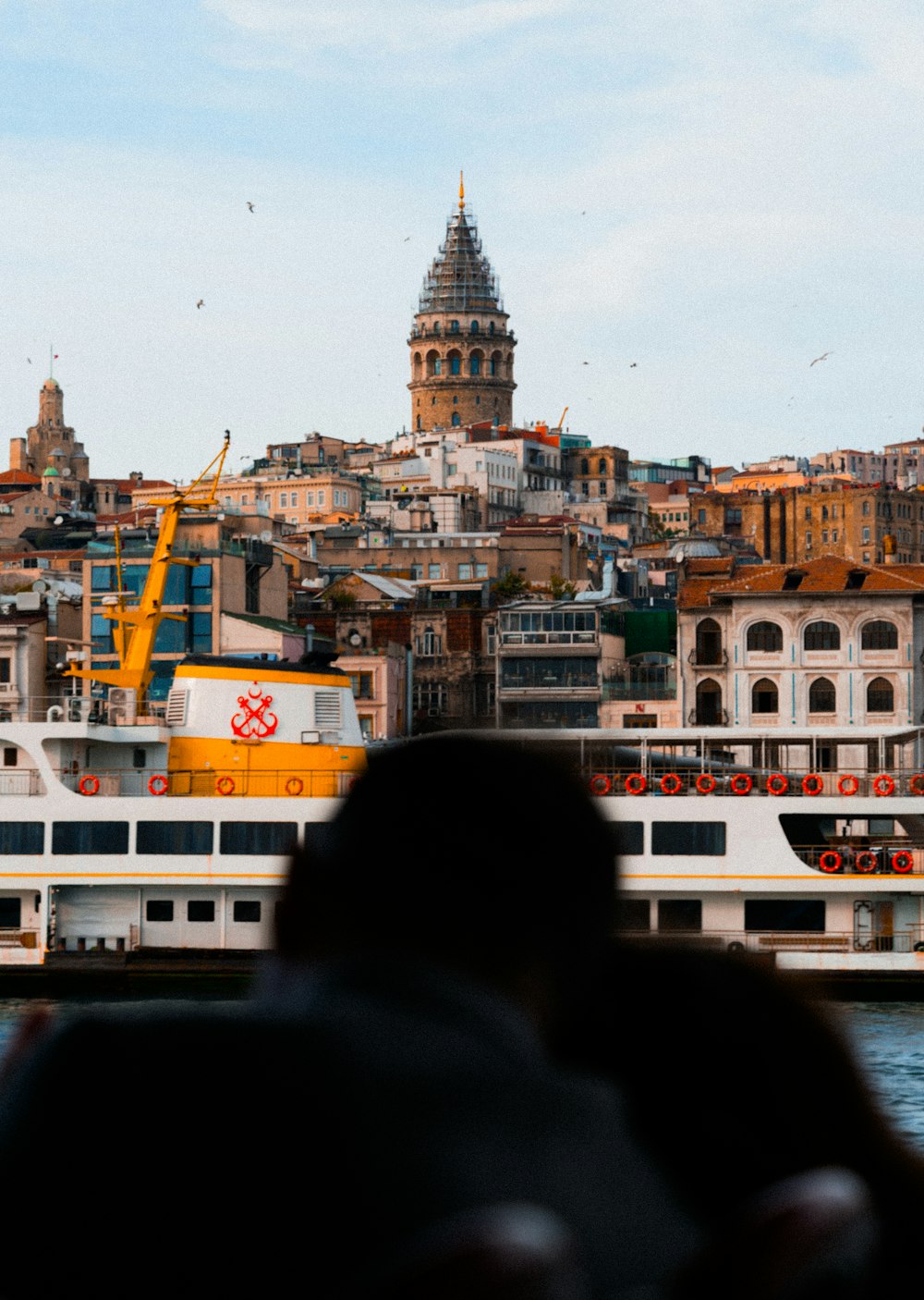 a person is looking at a boat in the water