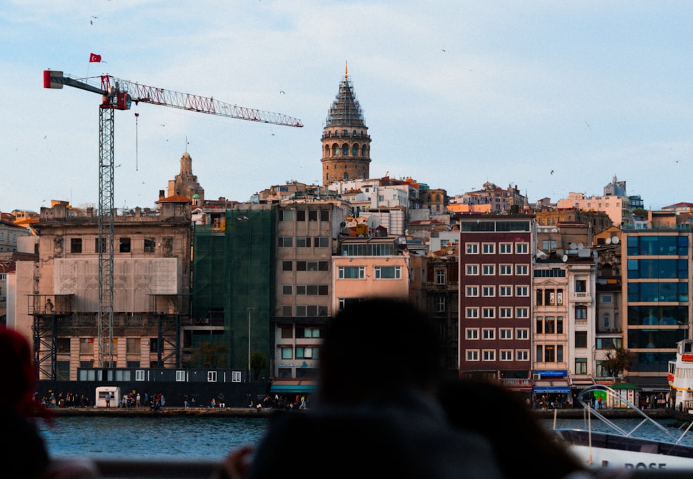 a view of a city with a crane in the background