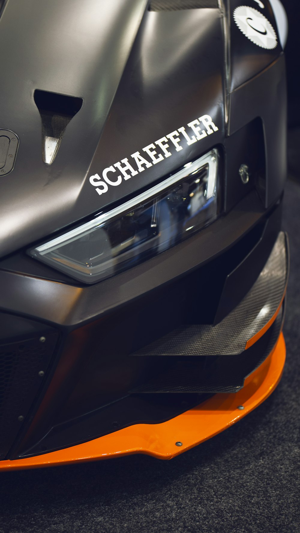 a close up of the front of a sports car