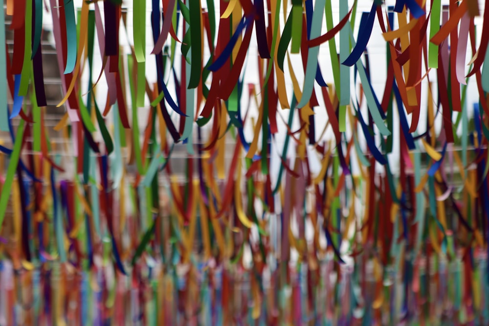 a group of ribbons hanging from a ceiling