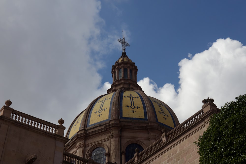 a large dome with a cross on top of it