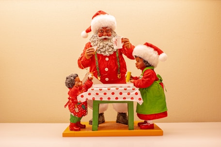 Santa Claus interacting with families during a festive event.